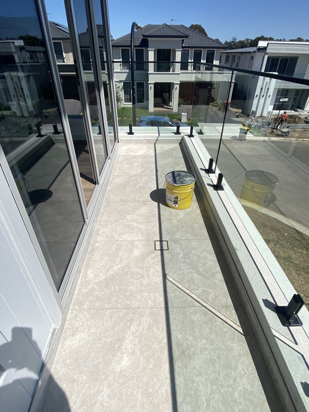 Front balcony built with no overflow outlet if the drain blocks, found during a handover inspection in Rouse Hill