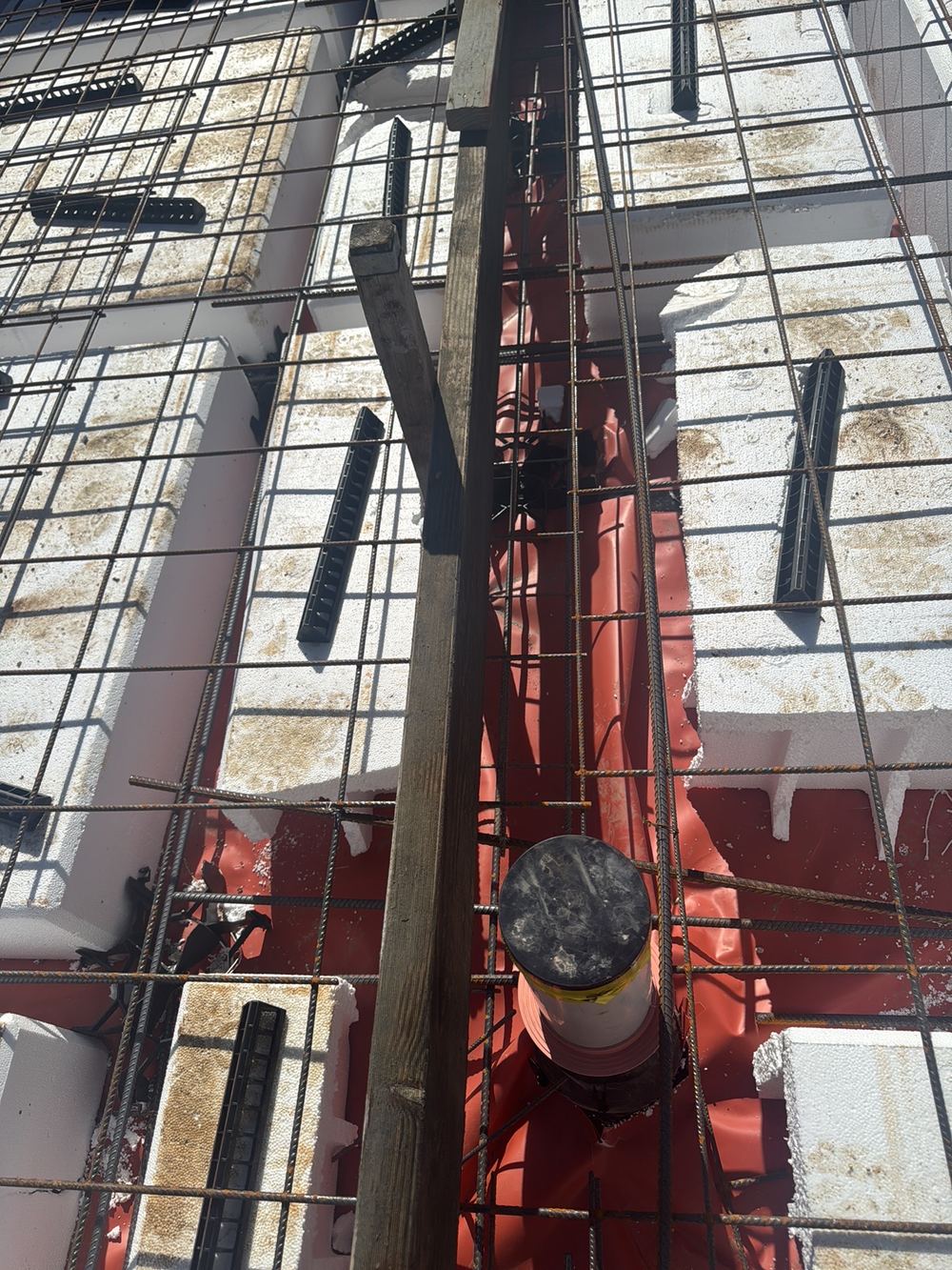 Pipe passing through the middle of a beam with no extra steel either side, Rouse Hill