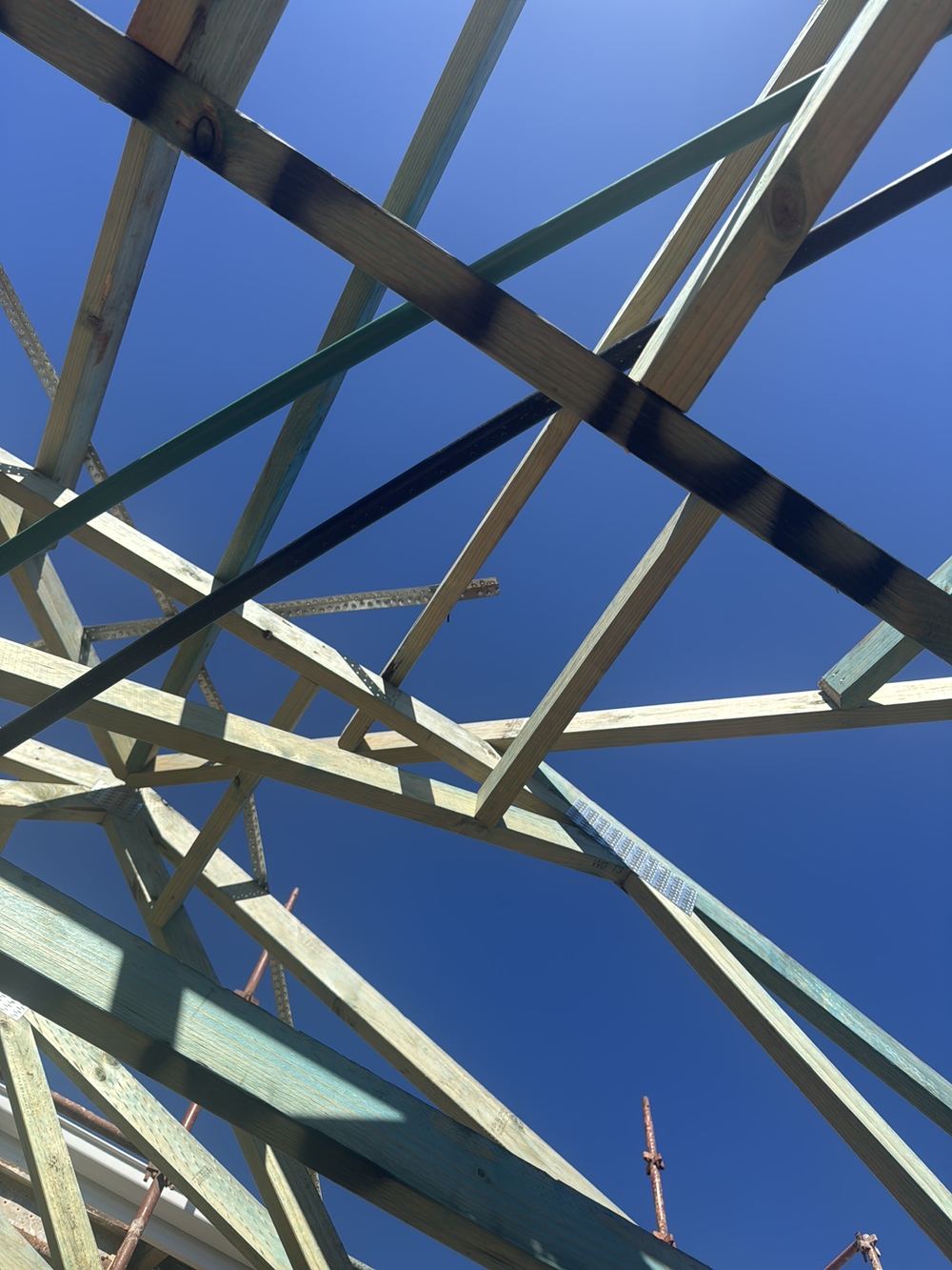 Roof brace not looped over and fixed to the side of the truss, found during a lock-up inspection in Rouse Hill