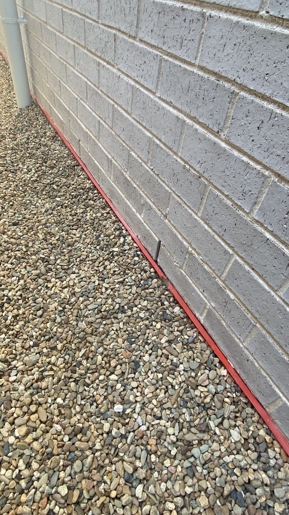 Damp course too close to the ground, inviting moisture and hidden termite entry, found during a handover inspection in Rouse Hill