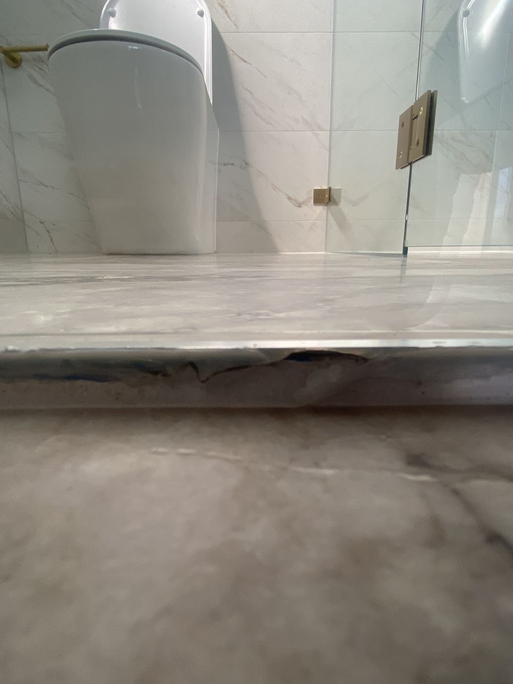 Gaps in the ensuite sealant that will let water escape the shower, Rouse Hill