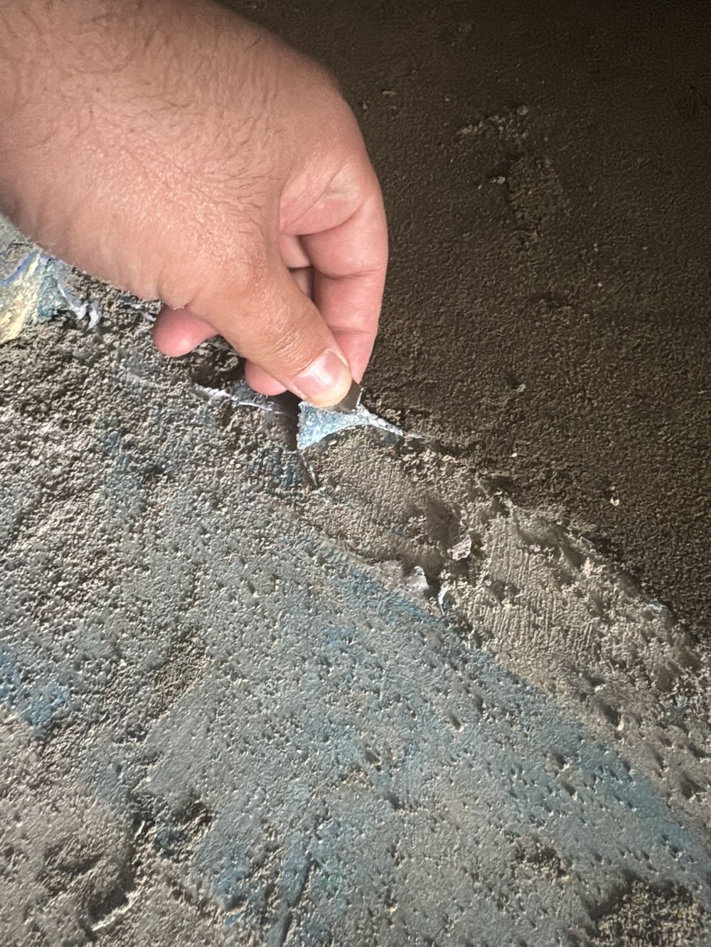 Membrane laid over a slab that was not cleaned, with dirt trapped beneath, found during a fixing stage inspection in Rouse Hill