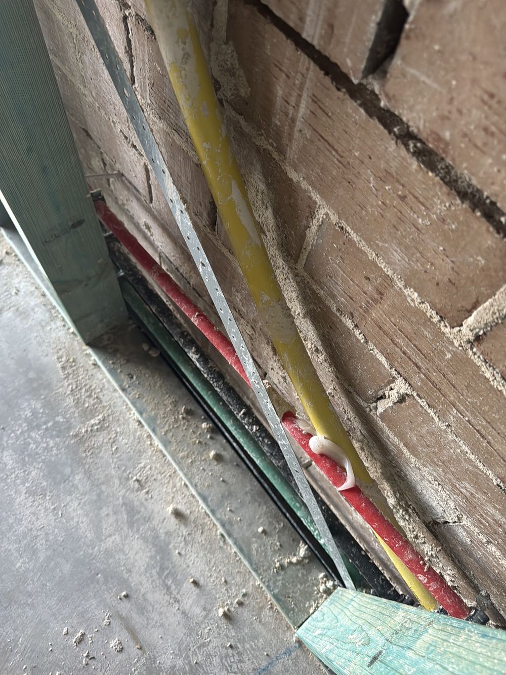 Copper water pipe touching steel framing with no separator between them, Rouse Hill