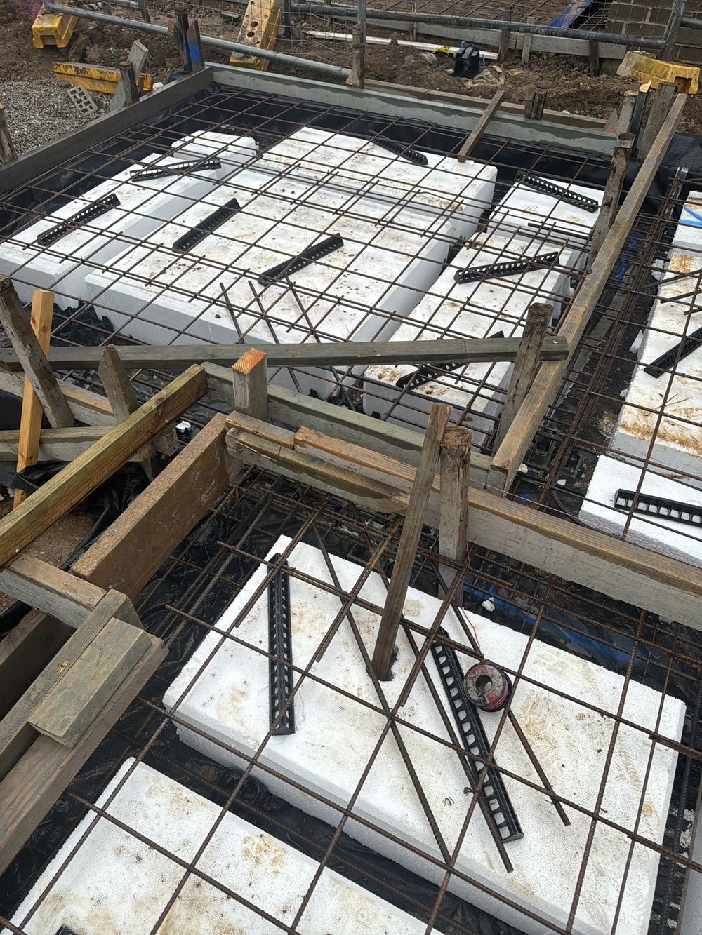 Re-entrant corner bars left out, so the slab corner has no crack control, found during a slab pre-pour inspection in Rouse Hill