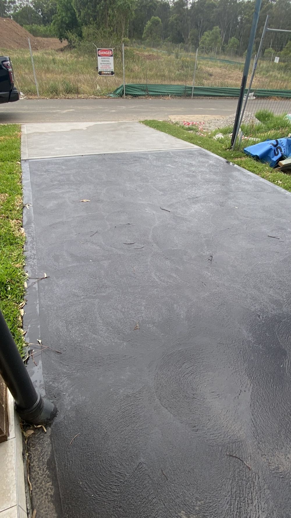 Uncut control joints in fresh paving, leaving it to crack where it chooses, found during a handover inspection in Rouse Hill