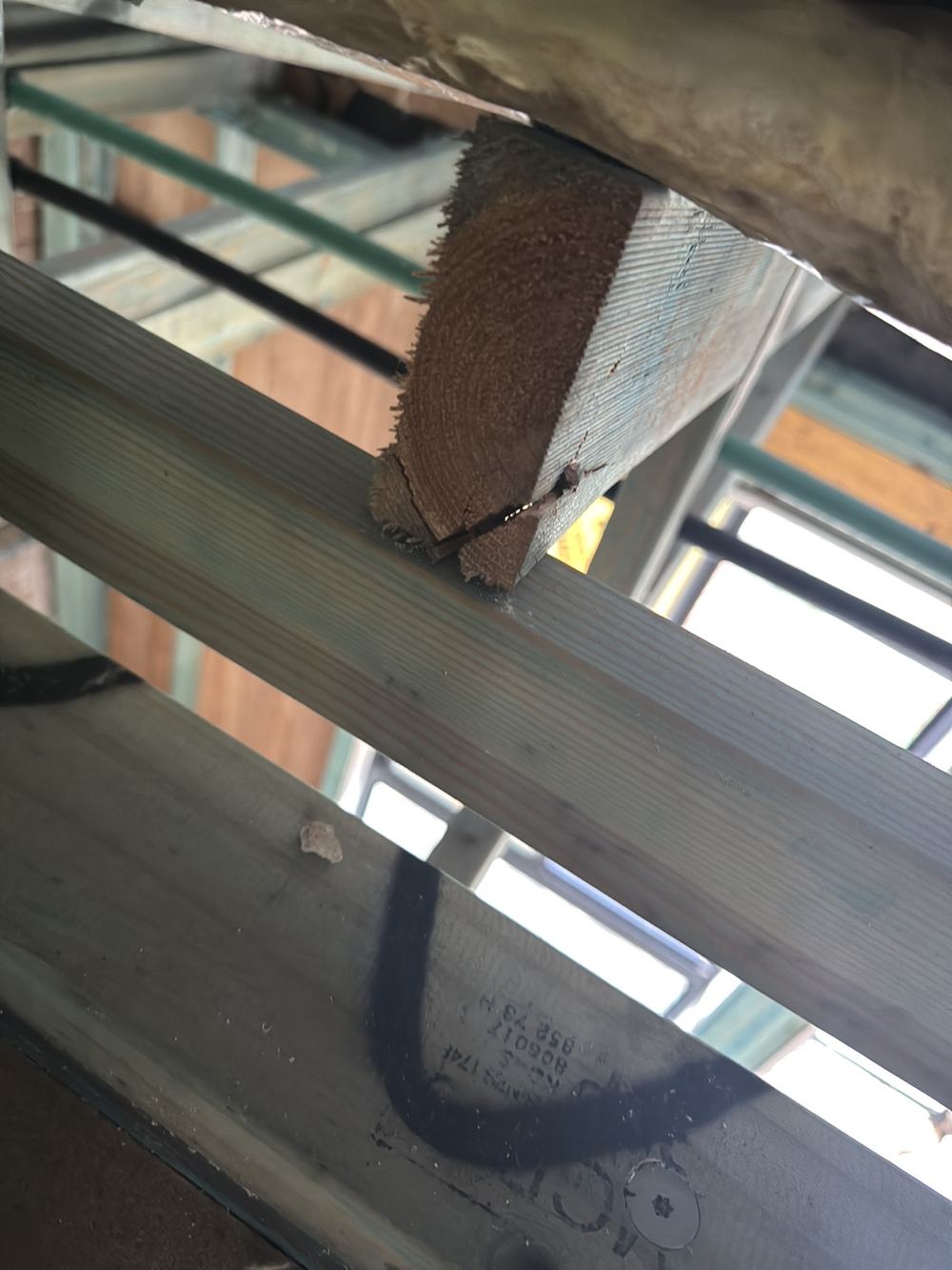 Truss timber split around its nail fixings, weakening that part of the truss, found during a lock-up inspection in Rouse Hill